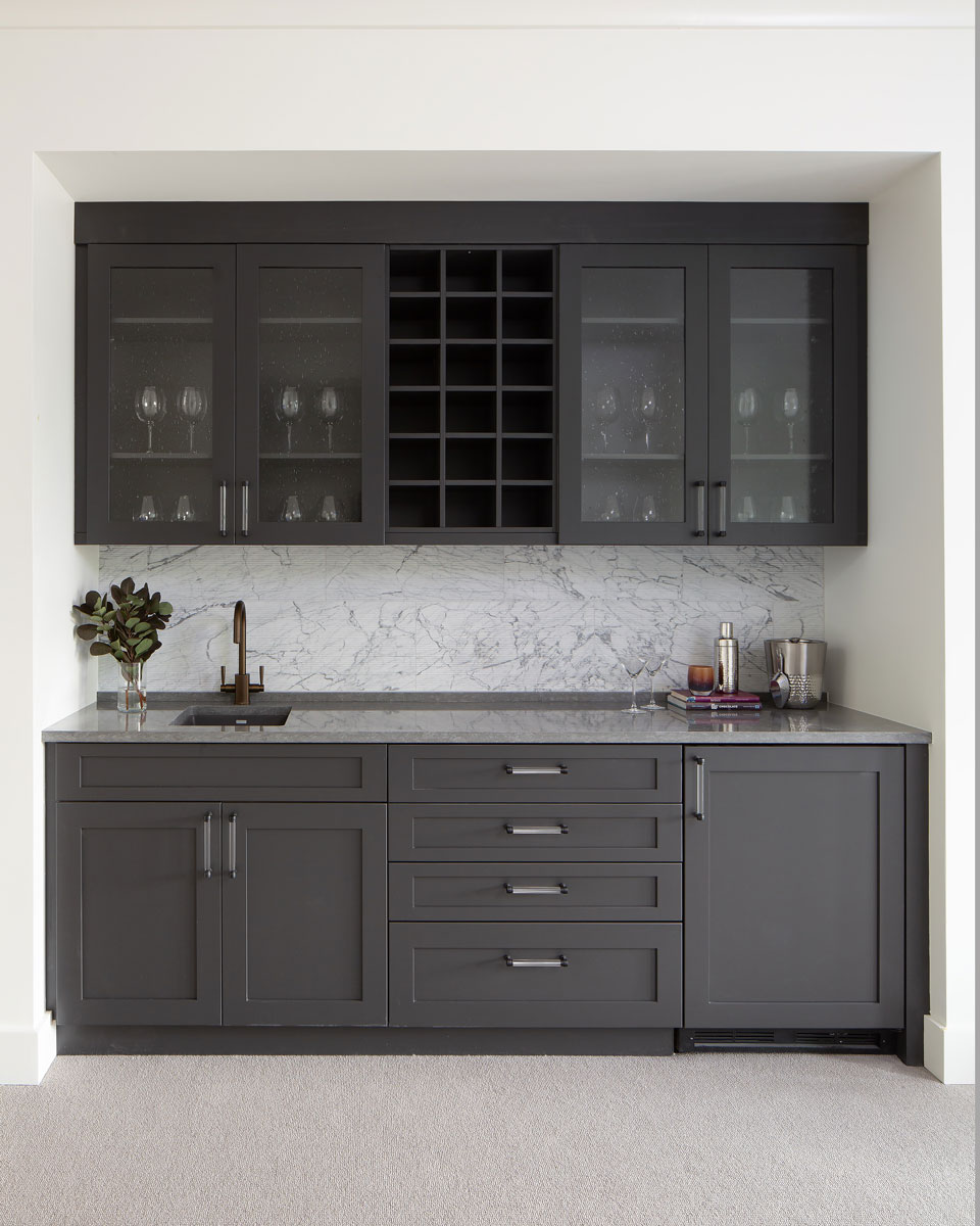 Large wet bar with dark gray cabinets